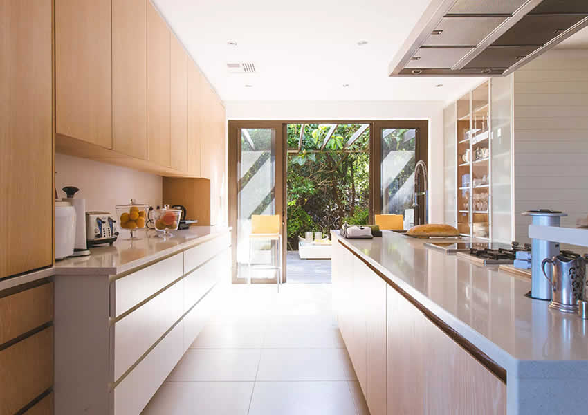 new kitchen makeover with patio doors leading to garden